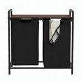 Laundry basket with black material and a dark brown wood surface. Black metal Frame